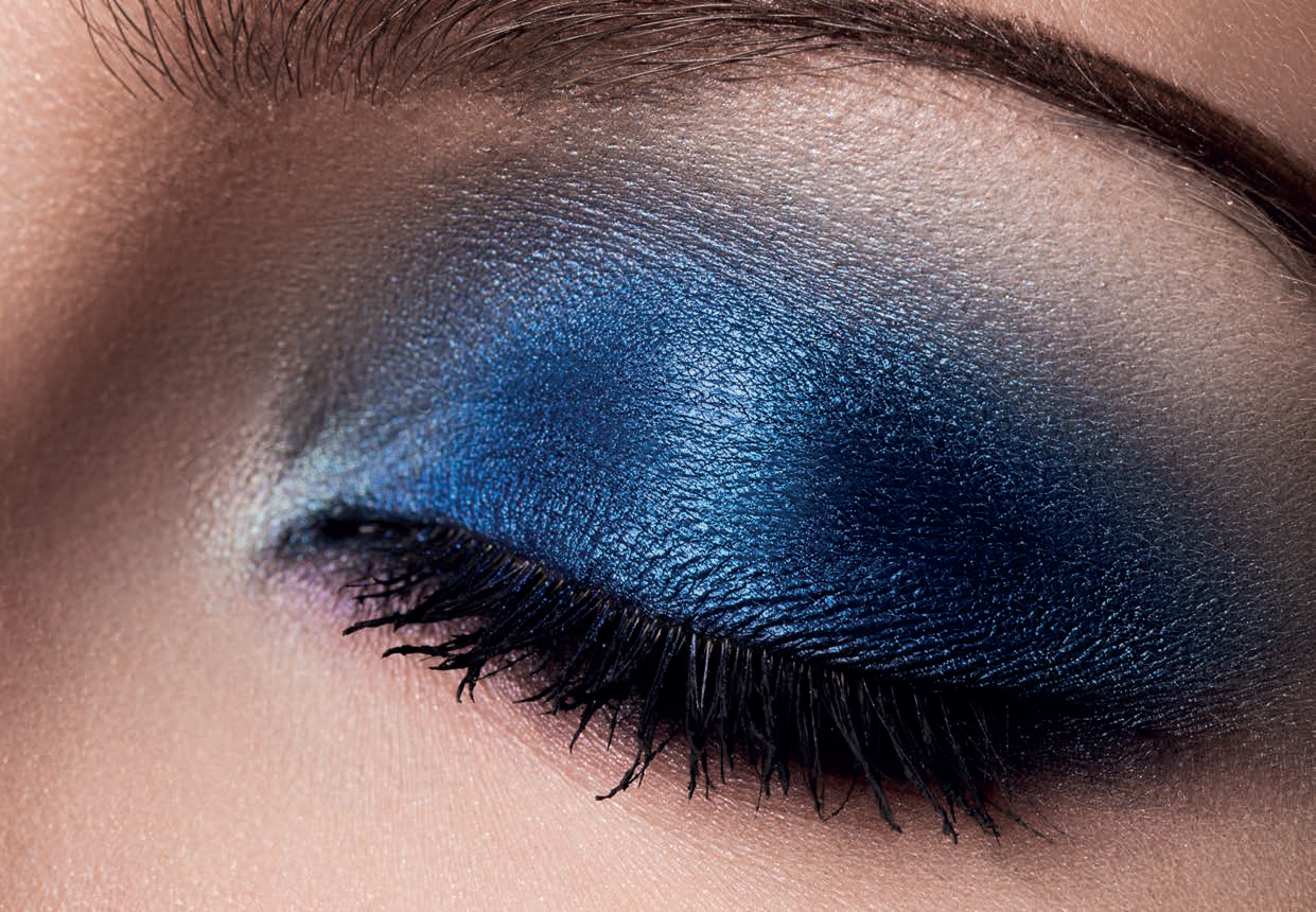 Blue eyeshadow applied to a closed eye